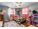 Whimsical bedroom with decorative pillows, patterned rug, and natural light at 3331 Loral Dr, Anderson, IN 46013