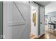 Hallway leading to bathroom and kitchen areas, with rustic door at 3331 Loral Dr, Anderson, IN 46013