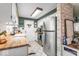 Well-lit kitchen featuring white cabinets, stainless steel appliances, and butcher block countertops at 3331 Loral Dr, Anderson, IN 46013