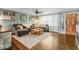 Inviting living room featuring a comfortable gray sofa, hardwood floors, and bright, natural light at 3331 Loral Dr, Anderson, IN 46013