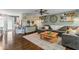Cozy living room with a large sectional sofa, stylish decor, and hardwood floors at 3331 Loral Dr, Anderson, IN 46013
