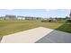Backyard with a concrete patio, grass, playground, and neighborhood at 3980 Canning St, Danville, IN 46122