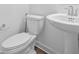 This bathroom features a white toilet and pedestal sink, perfect for a clean and modern design at 3980 Canning St, Danville, IN 46122