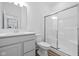 Modern bathroom features a glass shower, a white vanity, and wood-look flooring for style and function at 3980 Canning St, Danville, IN 46122