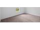 Well-lit bedroom features neutral carpet, a large window and trim, creating a bright and airy space at 3980 Canning St, Danville, IN 46122