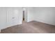 Spacious bedroom with neutral carpet, double door closet, and ample natural light at 3980 Canning St, Danville, IN 46122