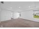 Spacious bedroom with neutral carpet and two windows letting in natural light at 3980 Canning St, Danville, IN 46122