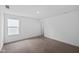 Neutral bedroom features one window and a door that leads to another room at 3980 Canning St, Danville, IN 46122