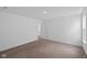 This is a view of a large bedroom with neutral carpeting and white walls at 3980 Canning St, Danville, IN 46122