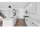 Modern kitchen featuring stainless steel appliances, granite countertops, an island, and sleek hardwood flooring at 3980 Canning St, Danville, IN 46122