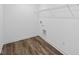 Functional laundry room featuring wood look floors and utility connections for appliances at 3980 Canning St, Danville, IN 46122