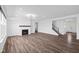 Bright and airy living room featuring a modern fireplace, recessed lighting, and elegant hardwood flooring at 3980 Canning St, Danville, IN 46122