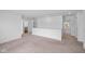 Open loft with neutral carpet and multiple doorways, offering versatile space for various activities at 3980 Canning St, Danville, IN 46122