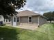 Backyard view features brick exterior and concrete patio at 951 Plaza W Dr # 7B, Martinsville, IN 46151