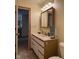 Bathroom featuring a vanity with storage and a mirror with decorative lighting at 951 Plaza W Dr # 7B, Martinsville, IN 46151