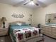 A well-lit bedroom with coordinated bedding and classic furniture at 951 Plaza W Dr # 7B, Martinsville, IN 46151