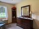 Bedroom with corner shelf, dresser, and view of outside through the window at 951 Plaza W Dr # 7B, Martinsville, IN 46151