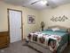 Cozy bedroom featuring a comfortable bed with a decorative quilt and neutral walls at 951 Plaza W Dr # 7B, Martinsville, IN 46151