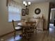 Cozy dining area with round table, chandelier and wood flooring at 951 Plaza W Dr # 7B, Martinsville, IN 46151