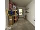 Garage area with storage shelving, room for storage, and access to the home at 951 Plaza W Dr # 7B, Martinsville, IN 46151