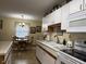 Bright kitchen featuring white cabinetry, and dining area at 951 Plaza W Dr # 7B, Martinsville, IN 46151