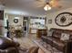 Inviting living room open to kitchen featuring wood floors and comfortable seating at 951 Plaza W Dr # 7B, Martinsville, IN 46151