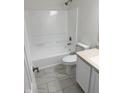 Bright bathroom featuring a shower-tub combination and modern finishes at 17902 Cristin Way, Westfield, IN 46062