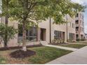 Apartment building exterior with landscaping and well-manicured lawn at 319 E 16Th St # 207, Indianapolis, IN 46202