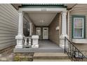 Inviting covered porch with columns, providing a cozy entrance to the home at 1433 E Fletcher Ave, Indianapolis, IN 46203