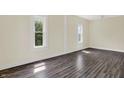 Sunlit bedroom with hardwood floors at 1901 N Tillotson Ave, Muncie, IN 47304