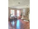 Inviting entryway with hardwood floors and a staircase leading to the upper level at 6343 Central Blvd, Whitestown, IN 46075