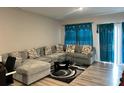 Inviting living room featuring a large sectional sofa and stylish décor at 696 Scarsdale Ln, Danville, IN 46122