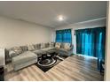 Inviting living room featuring a large sectional sofa and stylish décor at 696 Scarsdale Ln, Danville, IN 46122