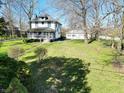 Charming home with a welcoming front porch and detached garage, set on a spacious lawn at 1185 N 10Th St, Noblesville, IN 46060