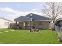 Charming single story brick home with a well-manicured lawn and cozy residential appeal at 2819 Mars Hill St, Indianapolis, IN 46241