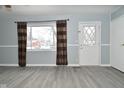Bright living room featuring hardwood floors and updated paint at 306 W Janet Dr, Brownsburg, IN 46112