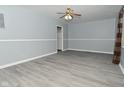 Living room with gray walls, vinyl floors and ceiling fan at 306 W Janet Dr, Brownsburg, IN 46112
