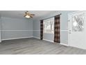 Spacious living room with gray walls and vinyl flooring at 306 W Janet Dr, Brownsburg, IN 46112