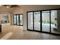 Light-filled dining area with hardwood floors and access to backyard patio at 10876 Holliday Farms Blvd, Zionsville, IN 46077