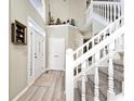 Bright foyer with wood flooring, staircase, and decor adds character to the home at 19140 Golden Meadow Way, Noblesville, IN 46060