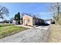 Charming brick home with a large driveway and a detached garage, perfect for extra storage or a workshop at 3612 Schofield Ave, Indianapolis, IN 46218