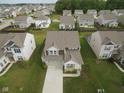 Aerial view of a home in a well-planned neighborhood with manicured lawns at 6748 Fallen Leaf Dr, Whitestown, IN 46075