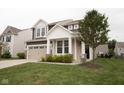 Charming two-story home featuring a two-car garage and a welcoming covered entry at 6748 Fallen Leaf Dr, Whitestown, IN 46075