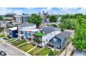 Aerial view of modern three-story home with rooftop balcony, complementing the neighborhood at 1218 Orange St, Indianapolis, IN 46203