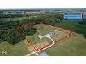 Aerial view with the property lines highlighted around a home with large wooded area at 9083 W Koger Ln, Martinsville, IN 46151