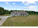 Charming blue two-story home with well-manicured lawn and gravel driveway at 9083 W Koger Ln, Martinsville, IN 46151