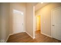 Bright foyer with wood floors and interior doors at 1157 Paul Revere Dr, Mooresville, IN 46158