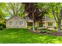 Attractive two-story home with stone accents, complemented by a well-manicured lawn and landscape at 725 Sugarbush Dr, Zionsville, IN 46077