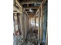 Hallway displaying exposed studs and wiring, ready to be renovated into a modern living space at 4026 W 141St St, Carmel, IN 46074