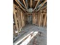 Hallway featuring exposed framing and ductwork, ready for renovation and customization at 4026 W 141St St, Carmel, IN 46074